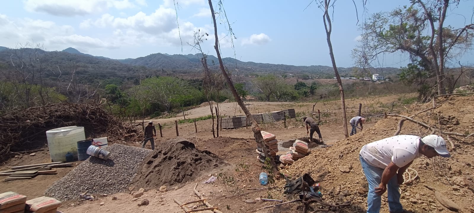 Construction site with mountain view in the background.