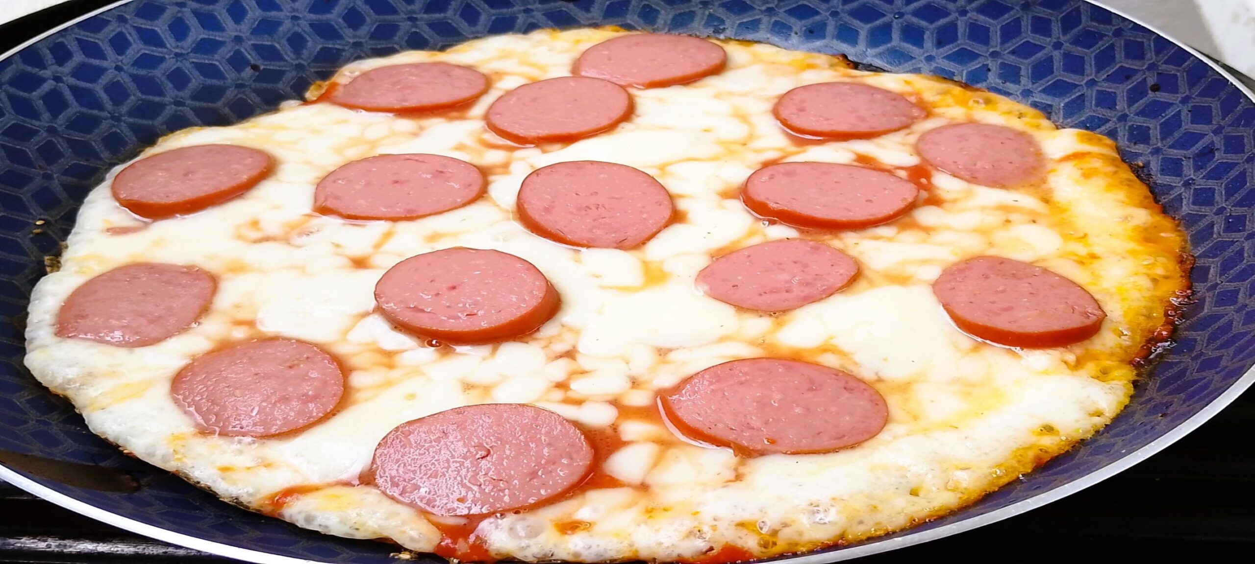 Pan pizza with sausage toppings