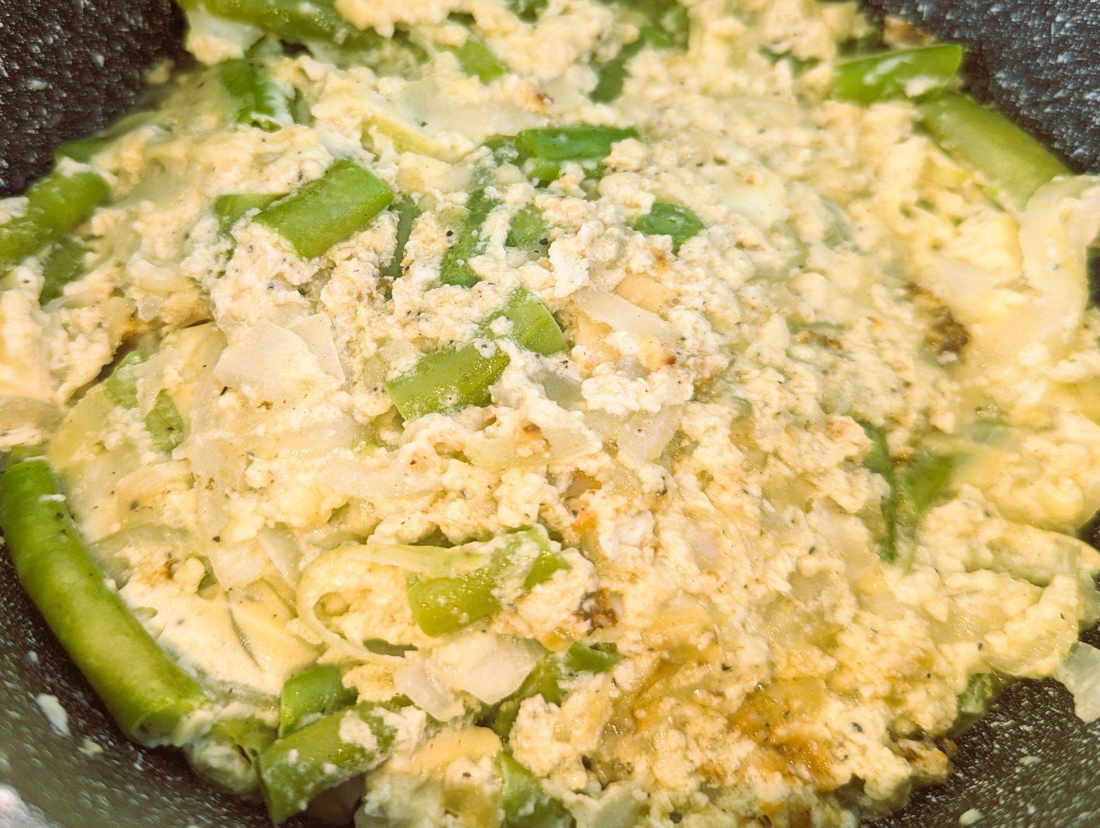 The almost-finished green bean and onion casserole, waiting for the top layer of cheese.