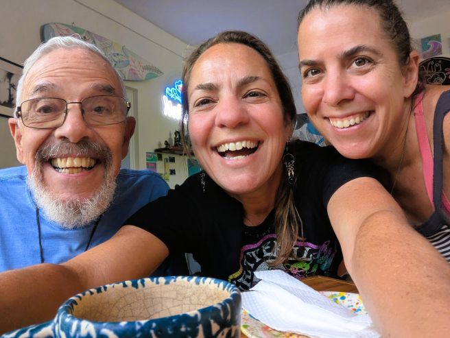 Family photo of father and two daughters